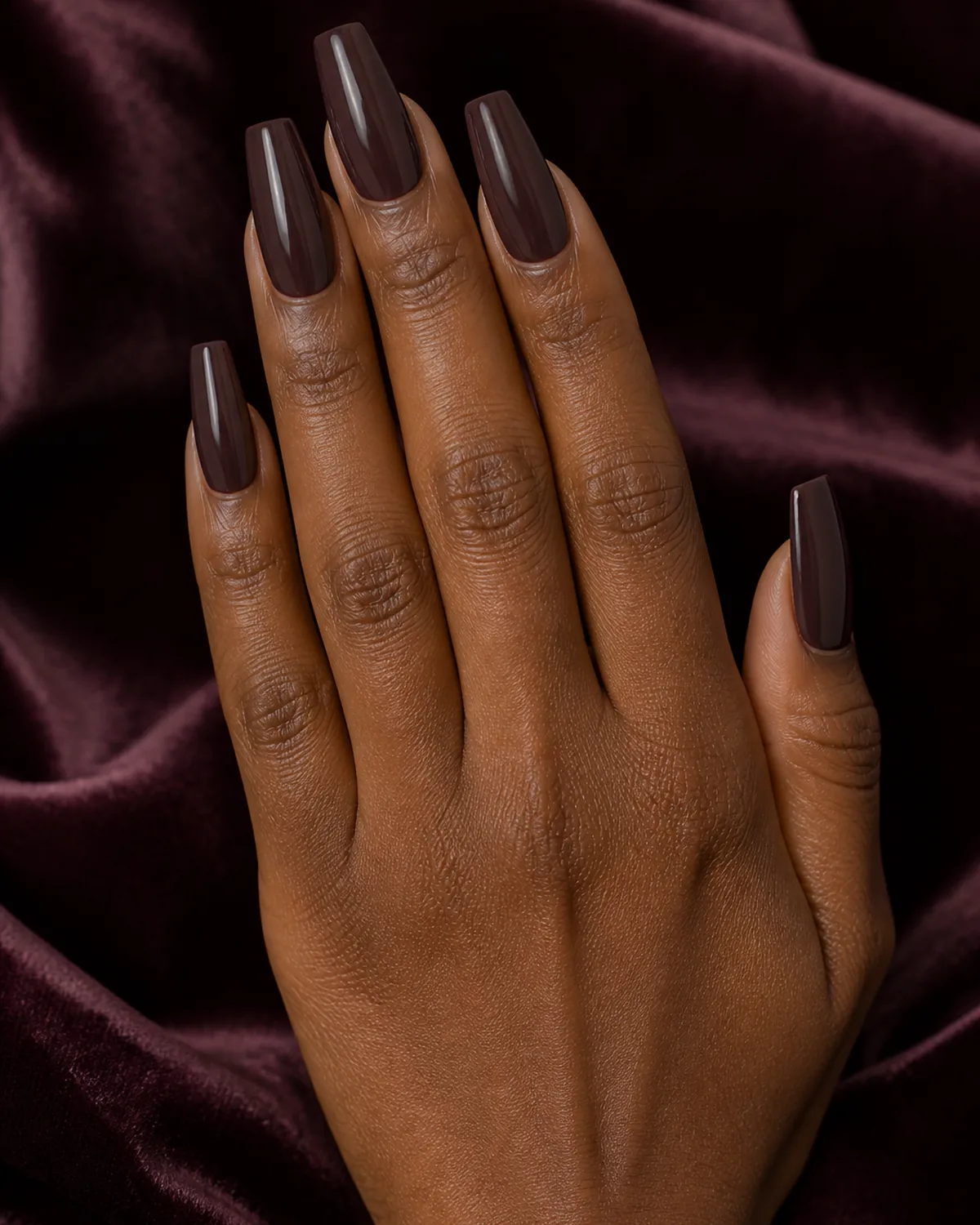 Chocolate plum gloss on long coffin nails