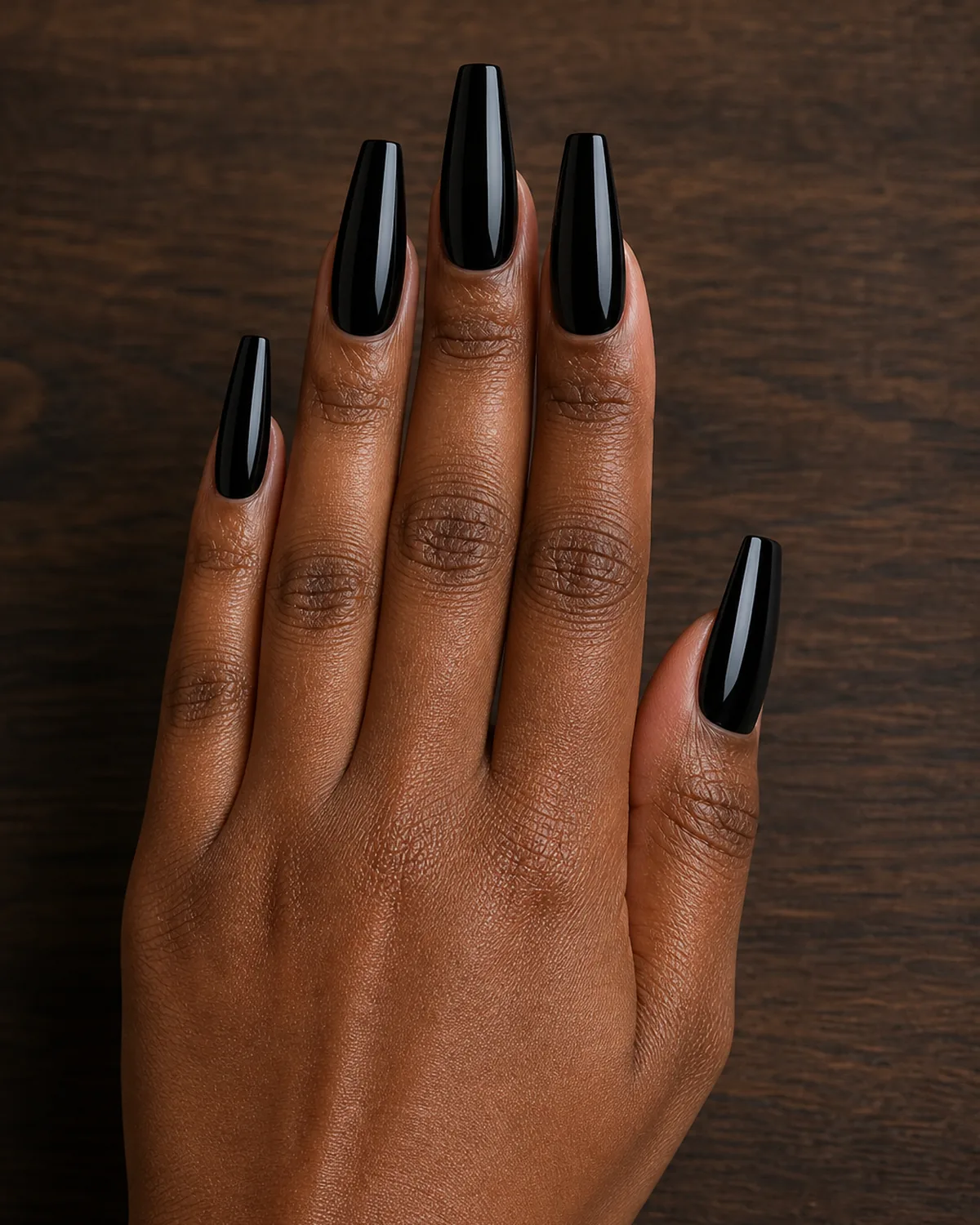 Glossy onyx black on long coffin nails