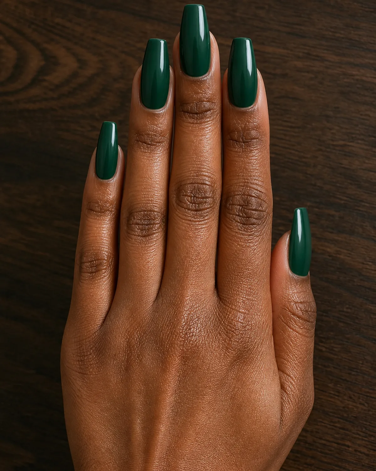 Deep forest-green cream on long coffin nails