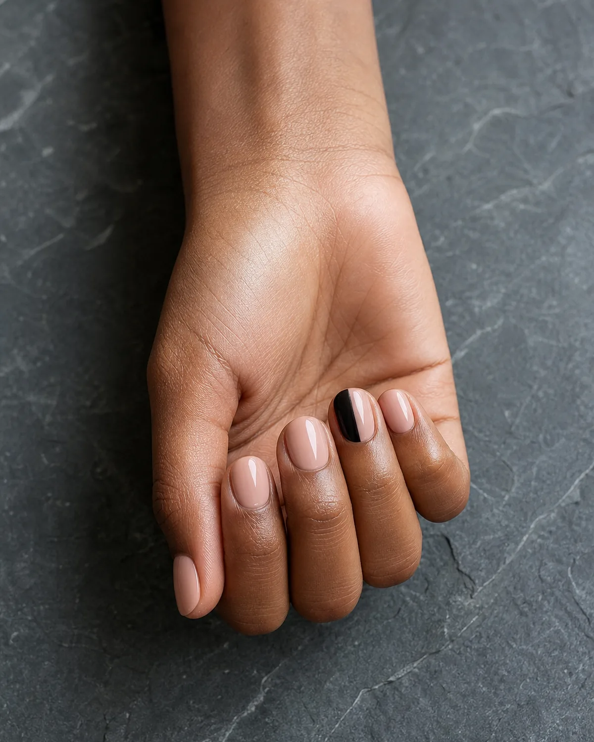 Black-and-nude two-tone accent on short-medium round nails