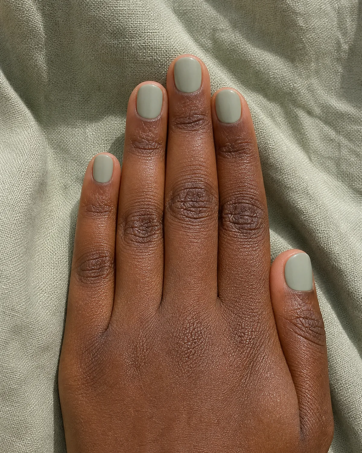 Sage green on short round nails